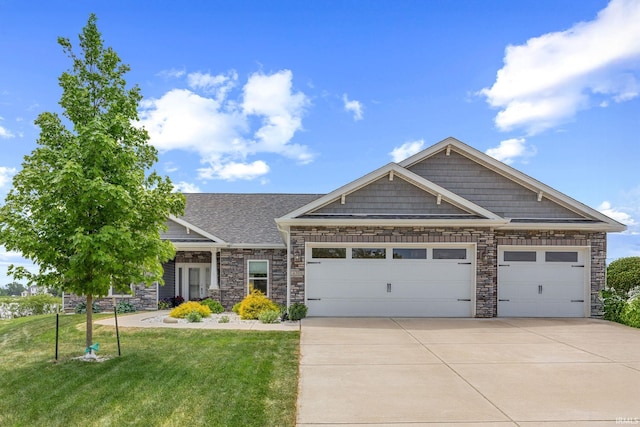 4300 Lithophone Ct, West Lafayette, IN 47906 - craftsman-style house with concrete driveway, a garage, a front lawn, and stone siding