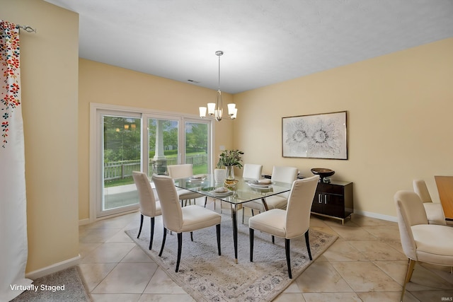 4300 Lithophone Ct, West Lafayette, IN 47906 - dining area featuring a chandelier, light tile patterned floors, and baseboards