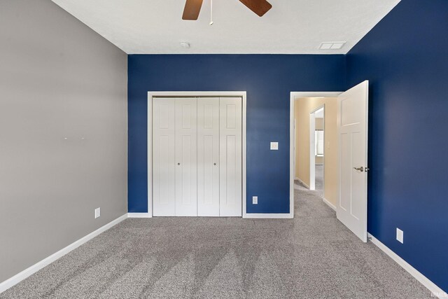 4300 Lithophone Ct, West Lafayette, IN 47906 - unfurnished bedroom with a closet, carpet, baseboards, and ceiling fan