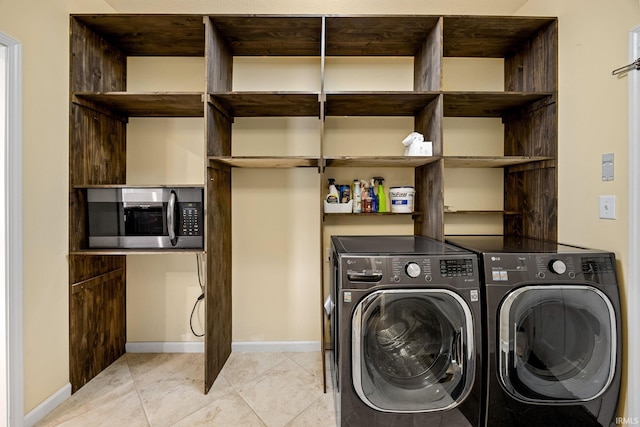 4300 Lithophone Ct, West Lafayette, IN 47906 - laundry area with washing machine and dryer, baseboards, and light tile patterned floors