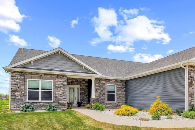4300 Lithophone Ct, West Lafayette, IN 47906 - view of front facade with a shingled roof, a front lawn, and stone siding