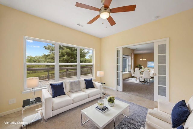 4300 Lithophone Ct, West Lafayette, IN 47906 - living area with light tile patterned floors, a ceiling fan, baseboards, and a chandelier