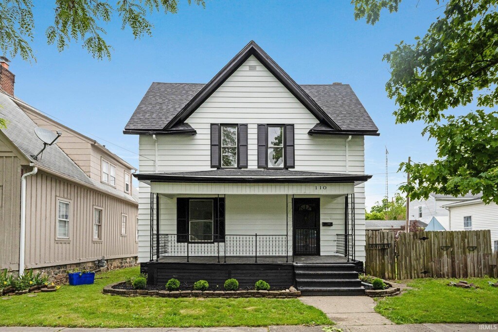 110 N Sheridan St, Kendallville, IN 46755 - view of front facade with covered porch and a shingled roof