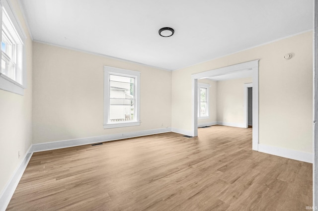 110 N Sheridan St, Kendallville, IN 46755 - spare room with crown molding, light wood-type flooring, baseboards, and a smoke detector