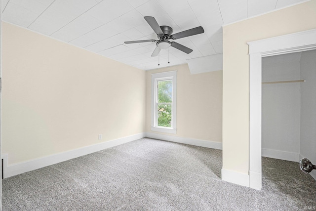 110 N Sheridan St, Kendallville, IN 46755 - unfurnished bedroom with carpet floors, baseboards, and a ceiling fan