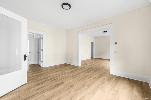 110 N Sheridan St, Kendallville, IN 46755 - unfurnished room with baseboards, light wood-style floors, and crown molding