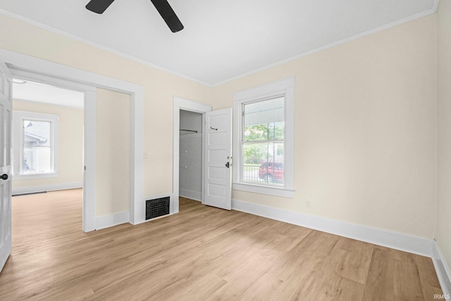 110 N Sheridan St, Kendallville, IN 46755 - unfurnished bedroom with light wood-type flooring, baseboards, crown molding, and a ceiling fan