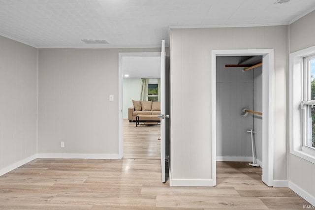 1310 Oak Ave, Lafayette, IN 47905 - unfurnished bedroom with multiple windows, a spacious closet, and light wood finished floors