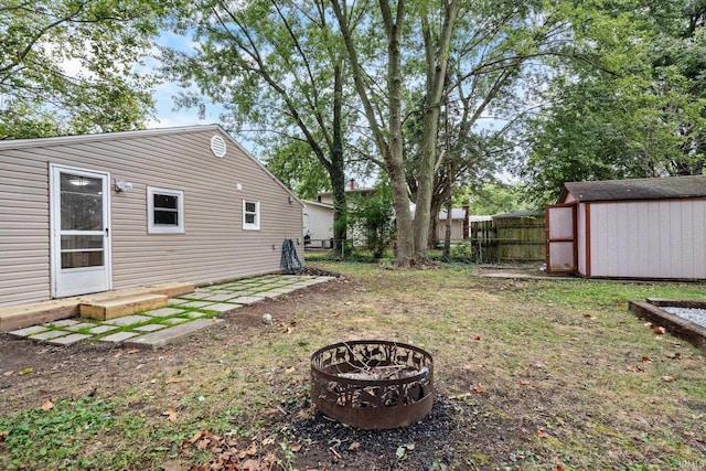 1310 Oak Ave, Lafayette, IN 47905 - fenced backyard with an outdoor fire pit