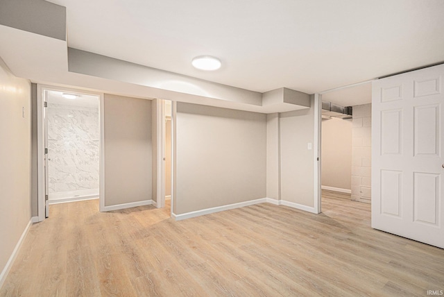 930 Oak Ridge Dr, South Bend, IN 46617 - finished basement with light wood-style flooring and baseboards