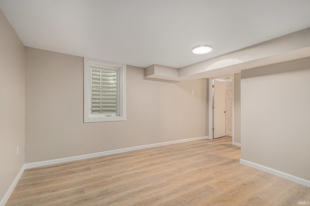 930 Oak Ridge Dr, South Bend, IN 46617 - finished basement with light wood-style flooring and baseboards