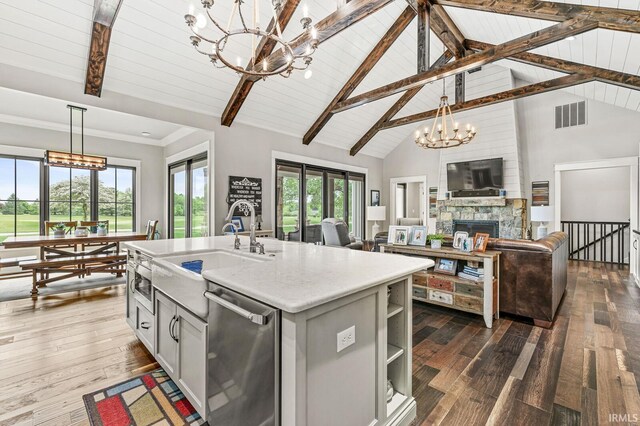 5847 Augusta Blvd, West Lafayette, IN 47906 - kitchen featuring a chandelier, stainless steel dishwasher, a sink, light countertops, and beam ceiling