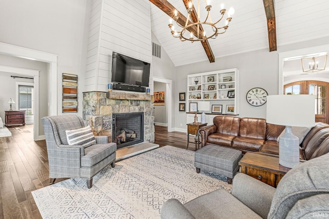 5847 Augusta Blvd, West Lafayette, IN 47906 - living room featuring a chandelier, wood finished floors, baseboards, a stone fireplace, and high vaulted ceiling