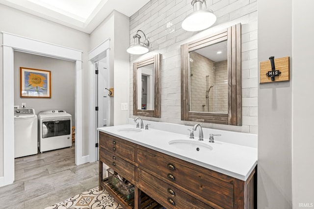5847 Augusta Blvd, West Lafayette, IN 47906 - full bathroom featuring washer and dryer, double vanity, and tiled shower