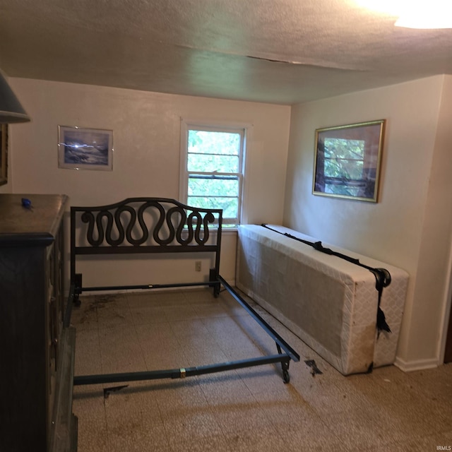 11544 Lincolnway Hwy, Osceola, IN 46561 - bedroom featuring tile patterned floors and a textured ceiling