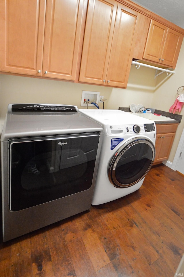 1632 Solemar Dr, West Lafayette, IN 47906 - laundry area featuring dark wood-style floors, independent washer and dryer, cabinet space, and baseboards