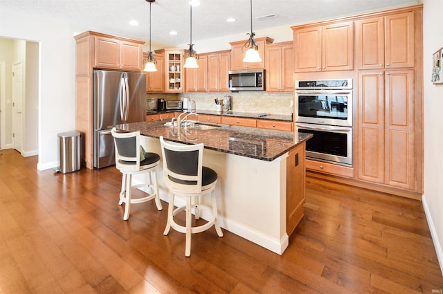 1632 Solemar Dr, West Lafayette, IN 47906 - kitchen featuring appliances with stainless steel finishes, a sink, recessed lighting, backsplash, and baseboards