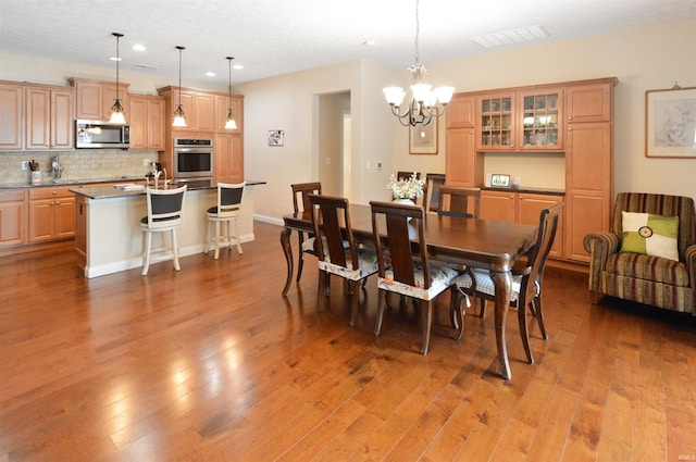 1632 Solemar Dr, West Lafayette, IN 47906 - dining room with recessed lighting, a chandelier, and wood finished floors