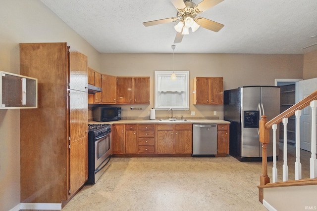 2000 Vinton St, Lafayette, IN 47904 - kitchen featuring stainless steel appliances, a sink, brown cabinetry, under cabinet range hood, and light countertops