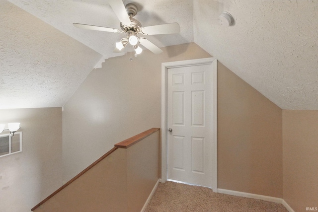 2000 Vinton St, Lafayette, IN 47904 - additional living space with a textured ceiling, lofted ceiling, ceiling fan, baseboards, and light carpet