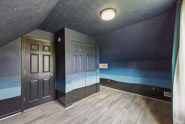 2000 Vinton St, Lafayette, IN 47904 - additional living space with vaulted ceiling and wood finished floors