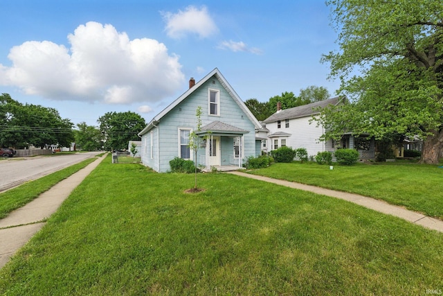 2000 Vinton St, Lafayette, IN 47904 - bungalow-style house featuring a chimney and a front lawn