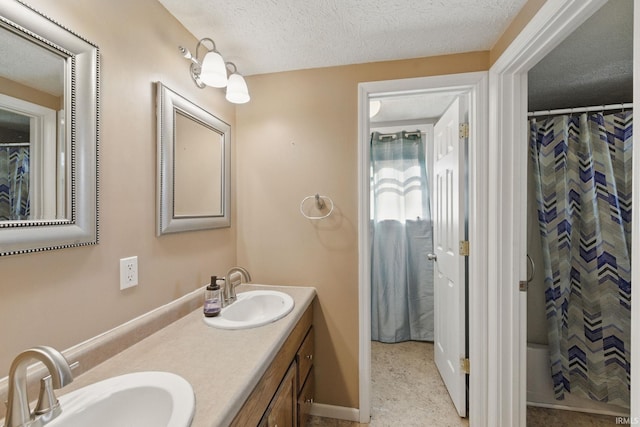 2000 Vinton St, Lafayette, IN 47904 - full bathroom with double vanity, a textured ceiling, and a shower with curtain