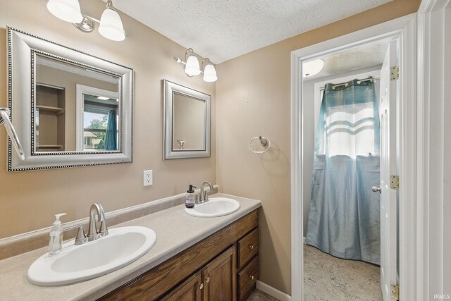 2000 Vinton St, Lafayette, IN 47904 - bathroom with double vanity and a textured ceiling