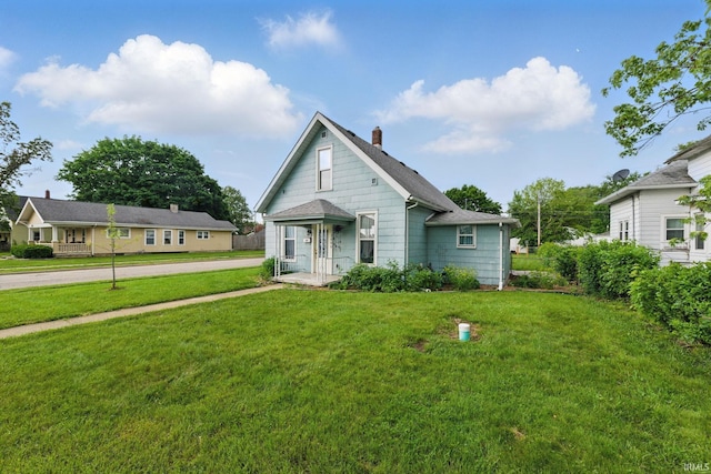 2000 Vinton St, Lafayette, IN 47904 - view of front of property with a chimney, a front yard, and roof with shingles
