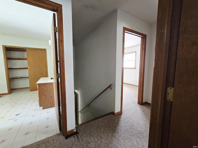 42 W Lakeside Dr, North Manchester, IN 46962 - corridor featuring an upstairs landing, baseboards, and light colored carpet