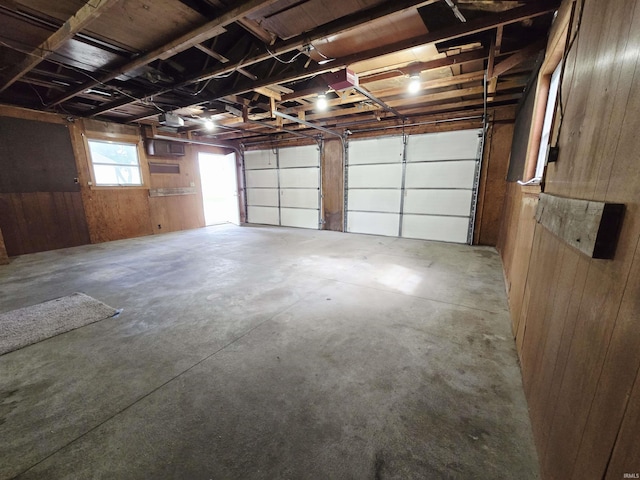 42 W Lakeside Dr, North Manchester, IN 46962 - garage featuring wooden walls and a garage door opener