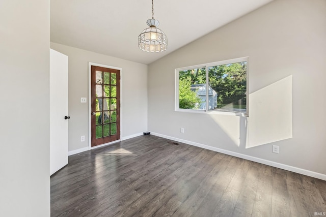 2509 Main St, Lafayette, IN 47904 - empty room with baseboards, dark wood-type flooring, vaulted ceiling, and a chandelier