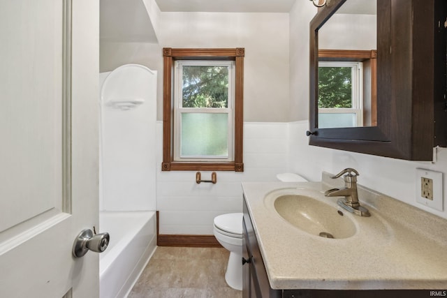 2509 Main St, Lafayette, IN 47904 - bathroom with vanity, toilet, and a wainscoted wall