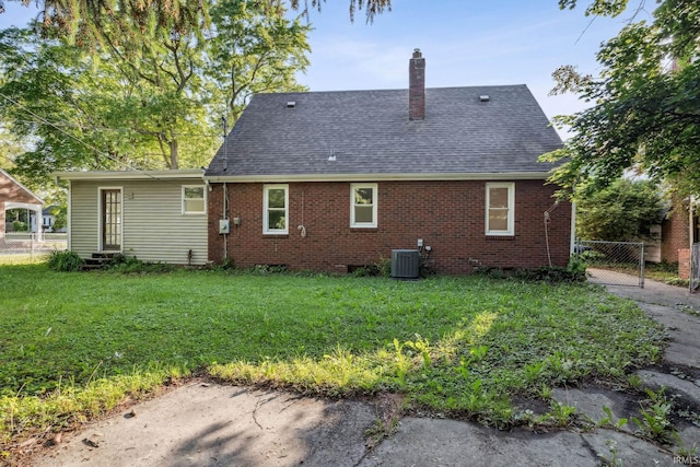 2509 Main St, Lafayette, IN 47904 - back of house with entry steps, a chimney, a shingled roof, and brick siding