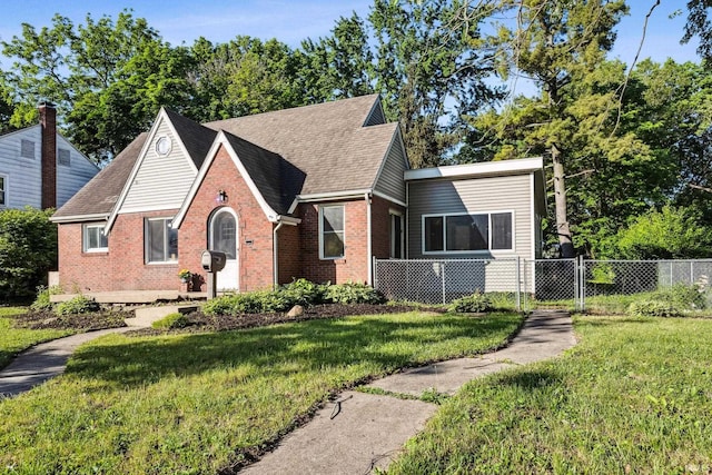 2509 Main St, Lafayette, IN 47904 - tudor-style house with brick siding and a shingled roof