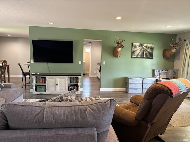 1264 W Greenbriar Dr, Washington, IN 47501 - living room featuring recessed lighting, baseboards, and wood finished floors