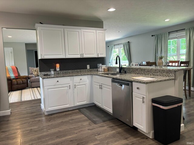 1264 W Greenbriar Dr, Washington, IN 47501 - kitchen featuring dishwasher, a sink, a peninsula, recessed lighting, and white cabinetry