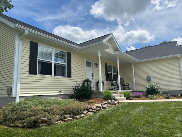 1264 W Greenbriar Dr, Washington, IN 47501 - view of front of property with covered porch, a front lawn, and a shingled roof