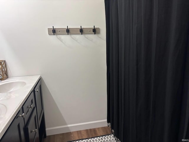 1264 W Greenbriar Dr, Washington, IN 47501 - full bath featuring double vanity, wood finished floors, and baseboards