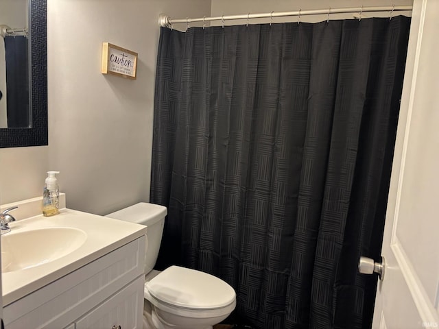 1264 W Greenbriar Dr, Washington, IN 47501 - bathroom with toilet, vanity, and curtained shower