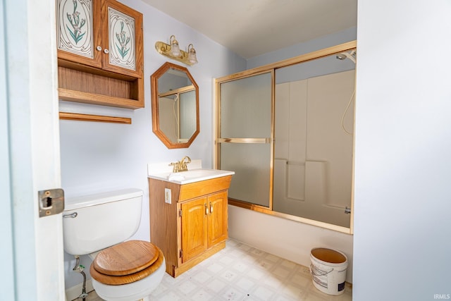 244 N Miami St, Wabash, IN 46992 - bathroom with vanity, tile patterned floors, toilet, and bath / shower combo with glass door