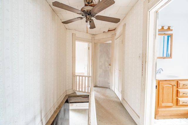 244 N Miami St, Wabash, IN 46992 - hallway with wallpapered walls, light colored carpet, and a sink