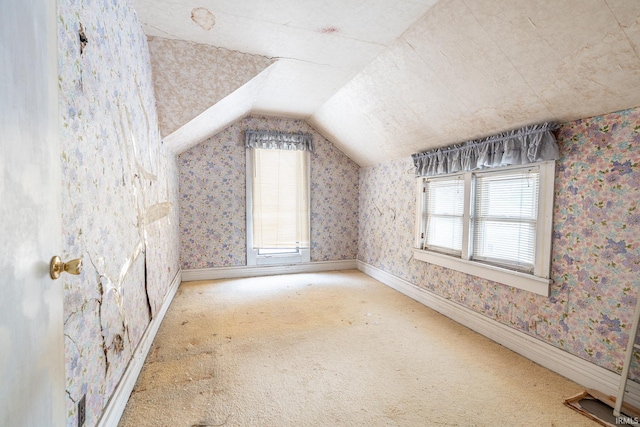 244 N Miami St, Wabash, IN 46992 - additional living space featuring vaulted ceiling, plenty of natural light, carpet floors, and wallpapered walls