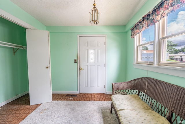 244 N Miami St, Wabash, IN 46992 - bedroom with baseboards, brick patterned flooring, a closet, and a textured ceiling