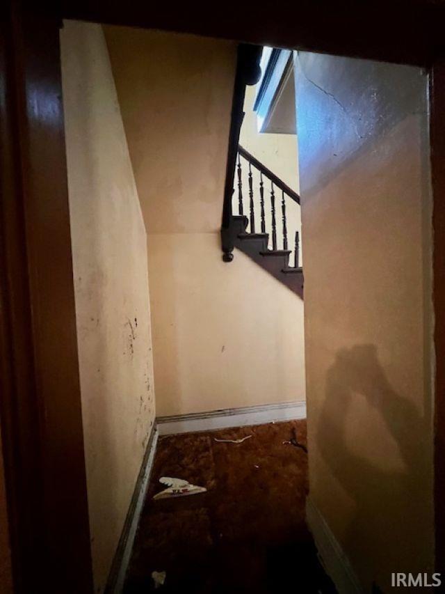718 E Lewis St, Fort Wayne, IN 46802 - staircase featuring baseboards