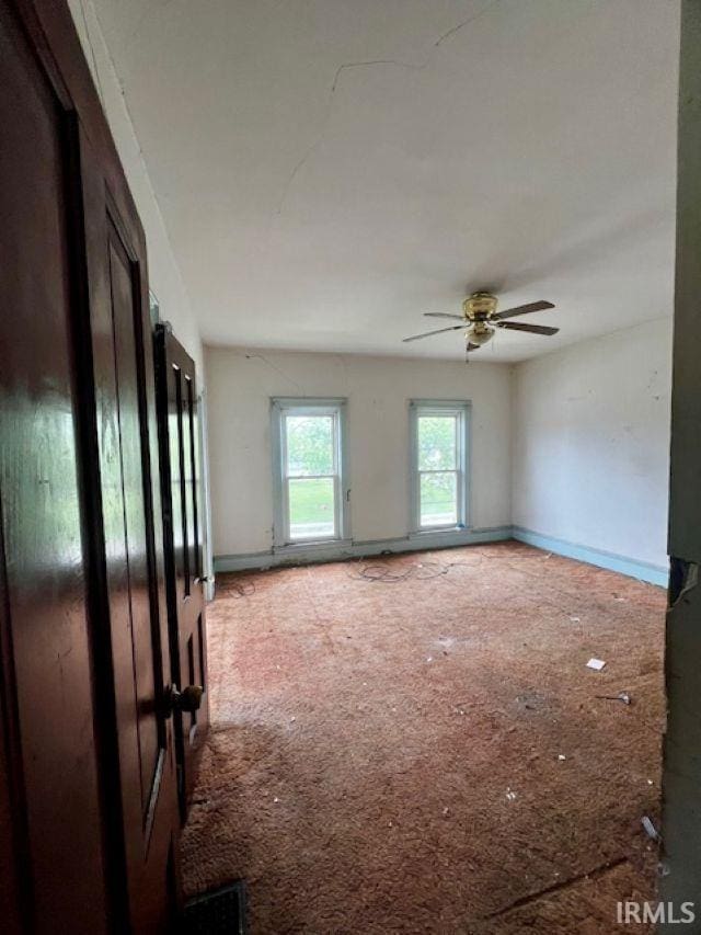 718 E Lewis St, Fort Wayne, IN 46802 - carpeted empty room featuring a ceiling fan