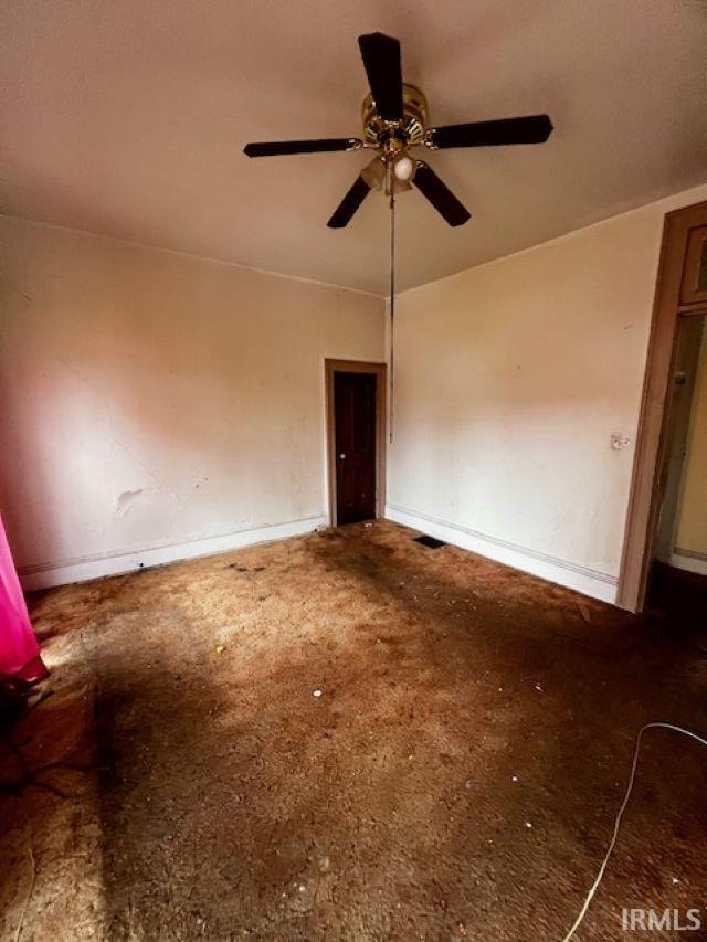 718 E Lewis St, Fort Wayne, IN 46802 - empty room featuring carpet, ceiling fan, and baseboards