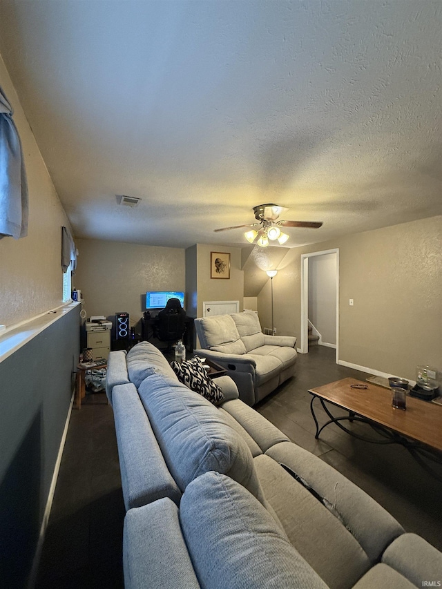 703 Downey Ave, Mishawaka, IN 46544 - living room featuring a ceiling fan, a textured ceiling, and a textured wall