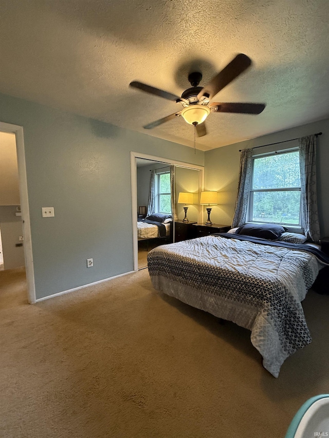 703 Downey Ave, Mishawaka, IN 46544 - carpeted bedroom with a textured ceiling and a ceiling fan