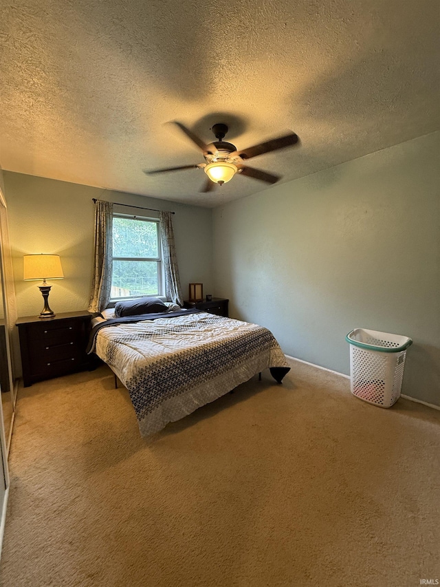 703 Downey Ave, Mishawaka, IN 46544 - bedroom with carpet floors, a textured ceiling, and ceiling fan